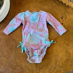 RuffleButts Floral Long Sleeve Rashguard One-Piece | 3–6M